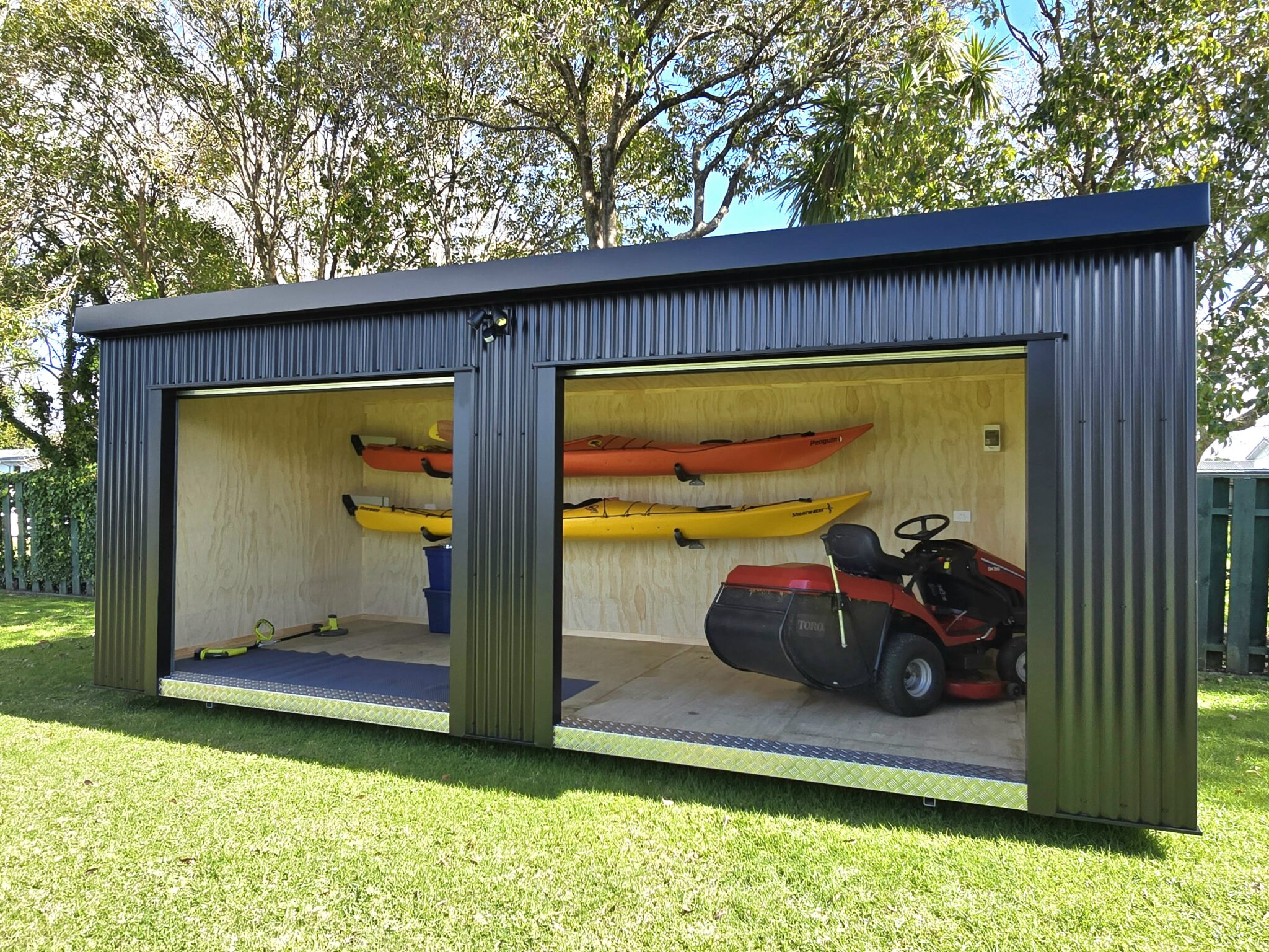 Utility shed with ride on lawn mower